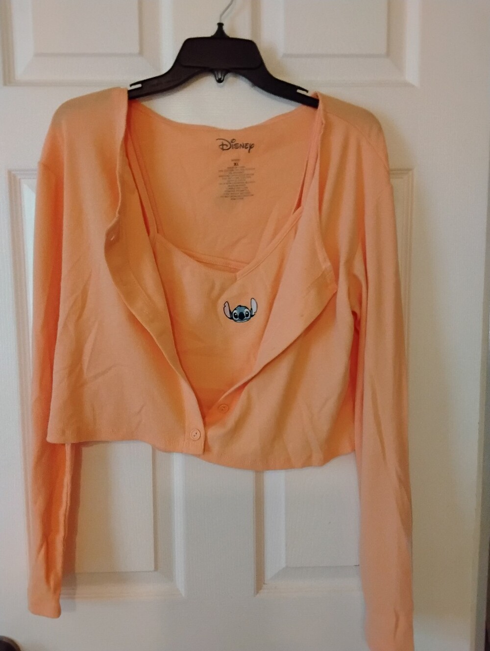 Disney neon orange long sleeve button front crop top featuring a STITCH graphic